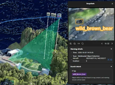 ドローンを用いた3Dマップ上での監視システムが示されており、右側のパネルには野生のヒグマが検出された際のスナップショットと、その警告詳細情報が表示されています
