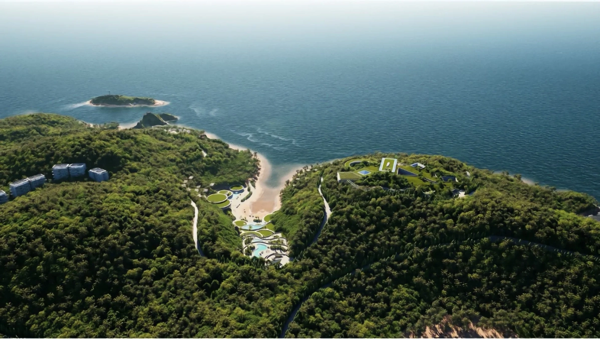 熱帯の島または半島を空撮した画像で、緑豊かな自然の中にモダンなリゾート施設が広がっています。白い砂浜のビーチ、複数のプール、そして海に面した高級な建物群が特徴的です。